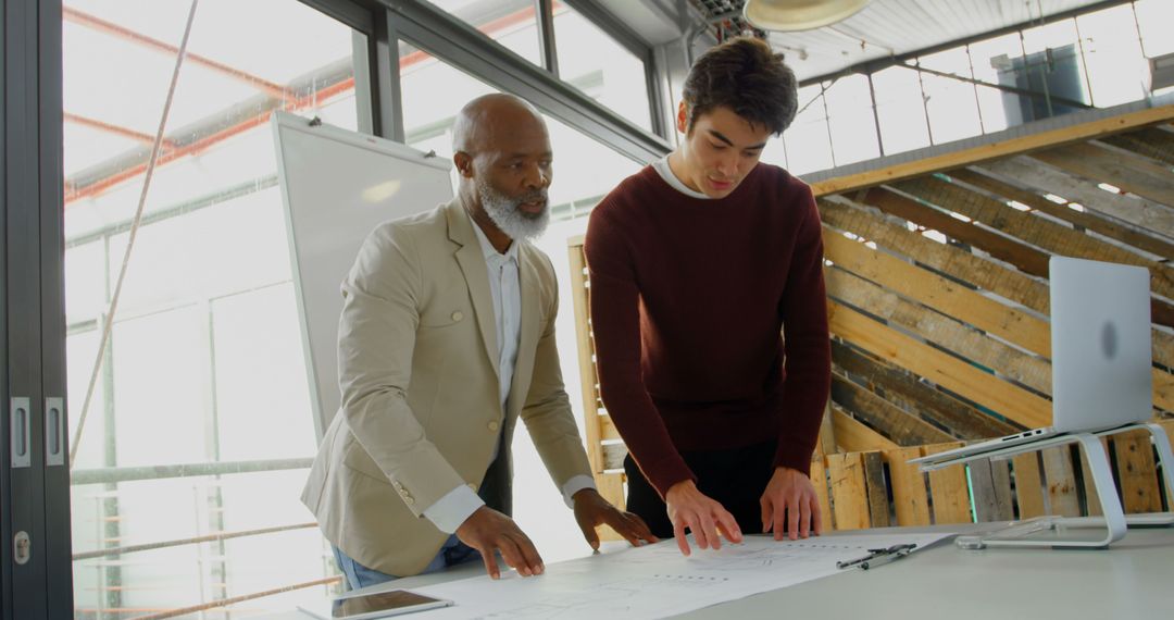 Architects Collaborating on Project in Modern Office Space