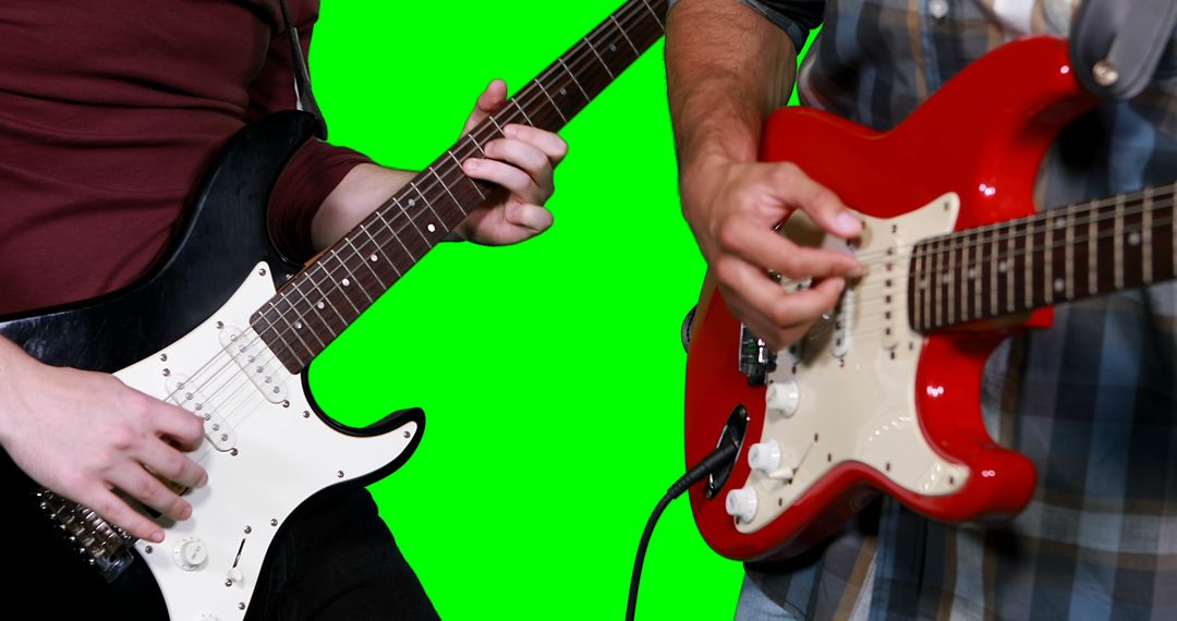 Guitarists Playing Electric Guitars Against Green Screen for Digital Background - Free Images, Stock Photos and Pictures on Pikwizard.com