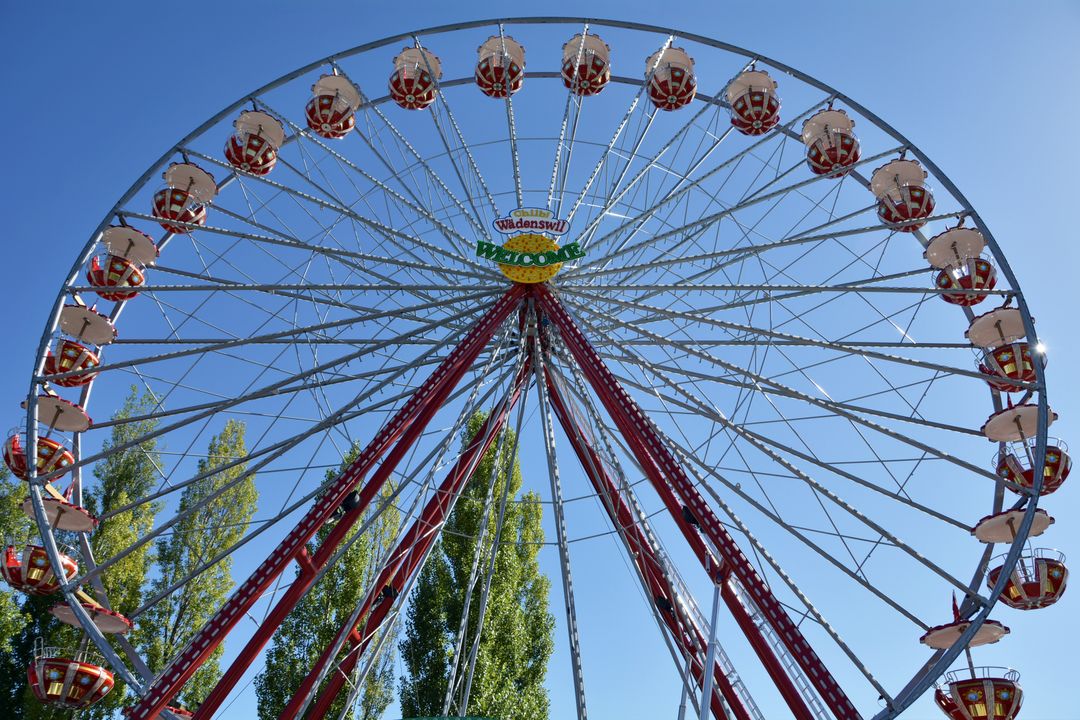 Giant Ferris Wheel in Amusement Park on Clear Day - Free Images, Stock Photos and Pictures on Pikwizard.com