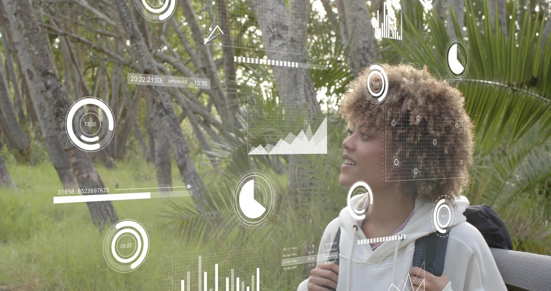 Woman exploring trail wearing backpack viewing augmented reality data overlays