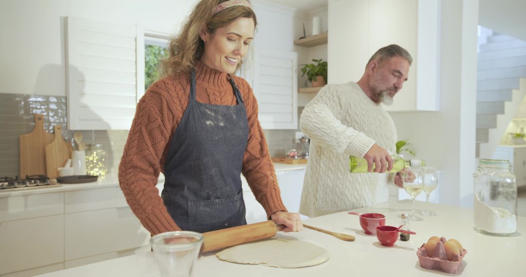 Couple Cooking Together in Modern Kitchen Preparing Homemade Dish