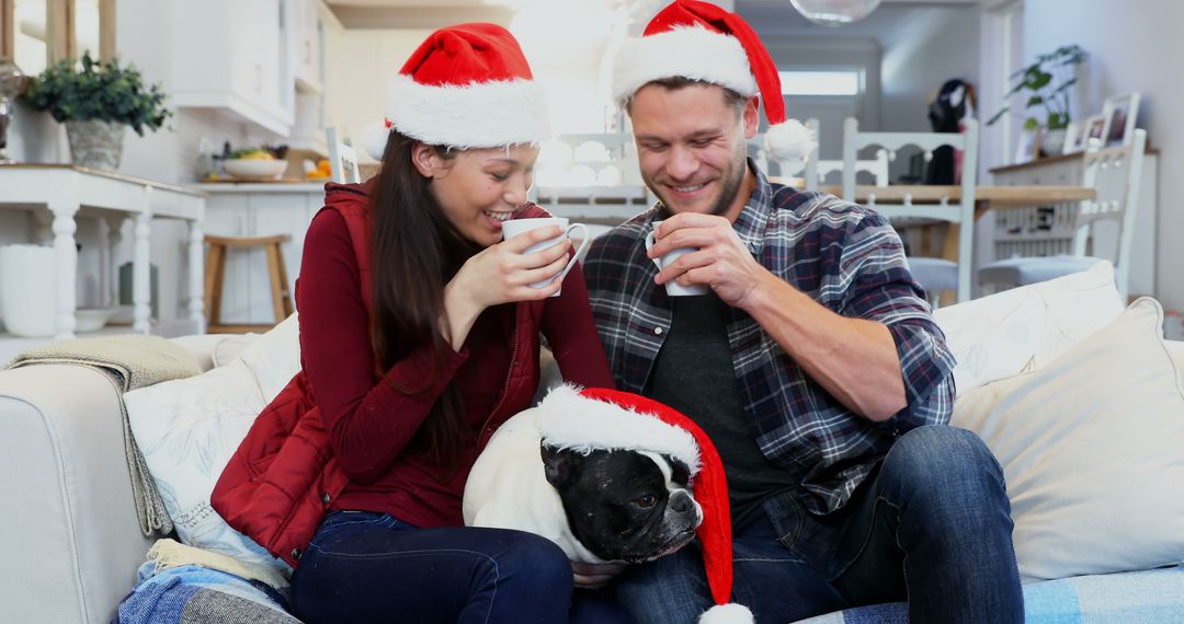 Happy Couple Enjoying Christmas With Dog on Sofa - Free Images, Stock Photos and Pictures on Pikwizard.com