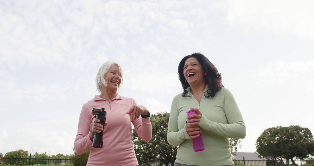 Two Mature Women Enjoying Outdoor Exercise and Laughter - Free Images, Stock Photos and Pictures on Pikwizard.com