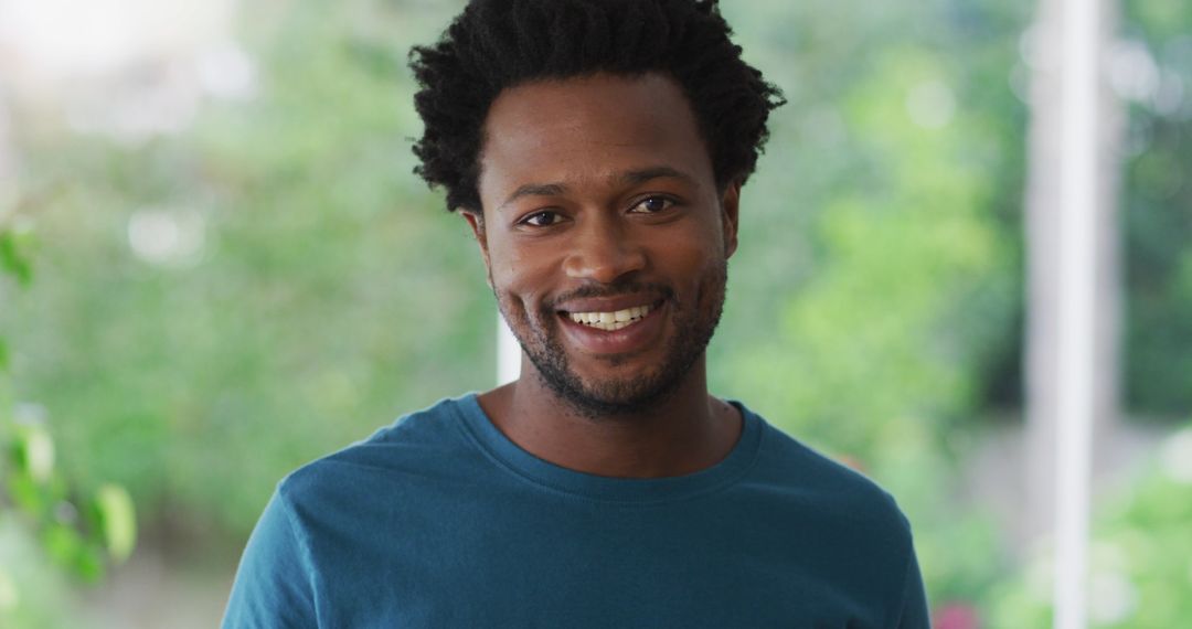 Smiling Biracial Man Enjoying Leisure Time at Home