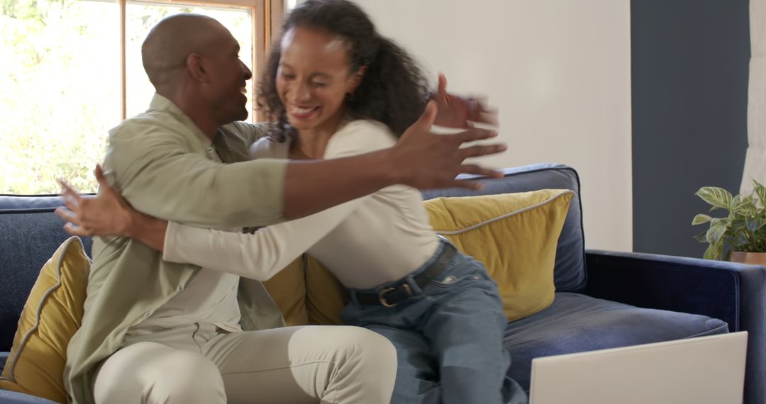 Happy Couple Hugging on a Comfortable Living Room Couch