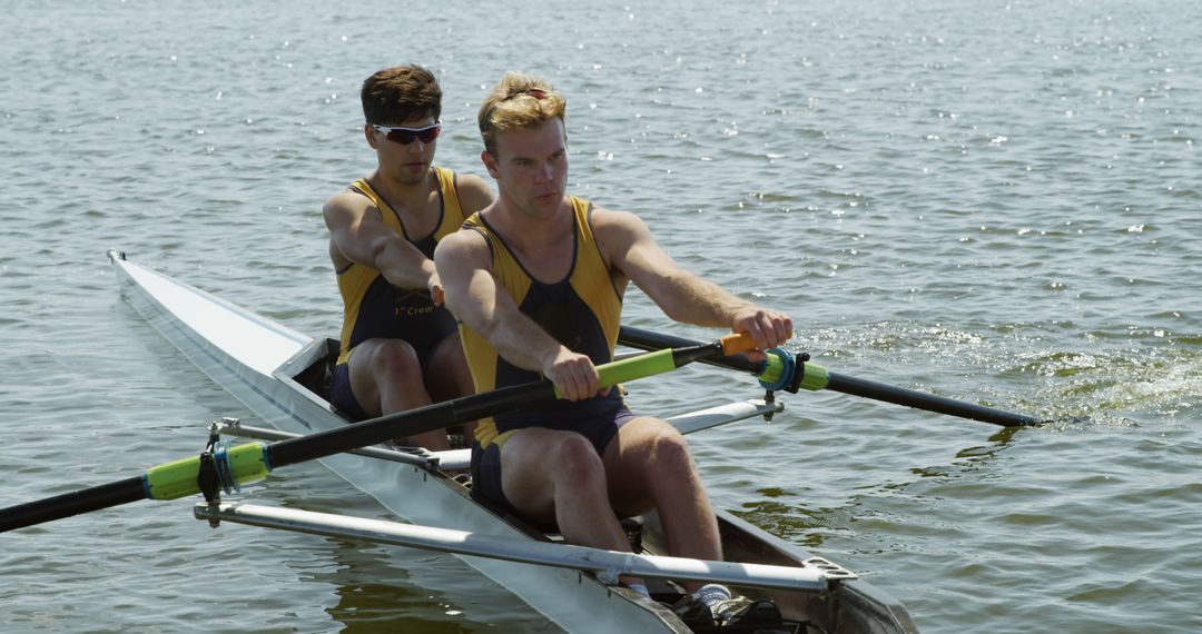 Two Male Rowers Training on a Lake in Rowing Boat - Free Images, Stock Photos and Pictures on Pikwizard.com