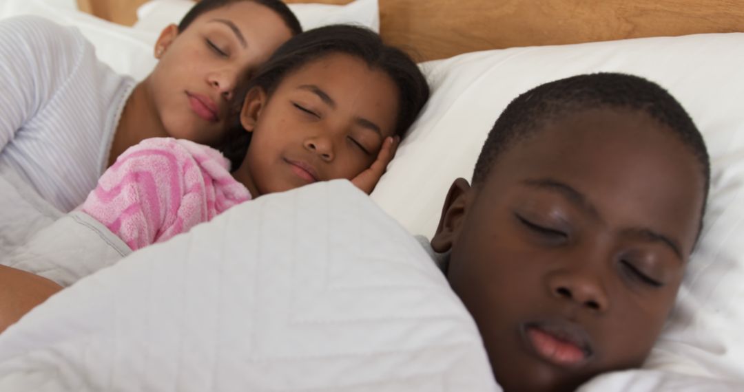 Peaceful African American Family Sleeping Together in Bed - Free Images, Stock Photos and Pictures on Pikwizard.com