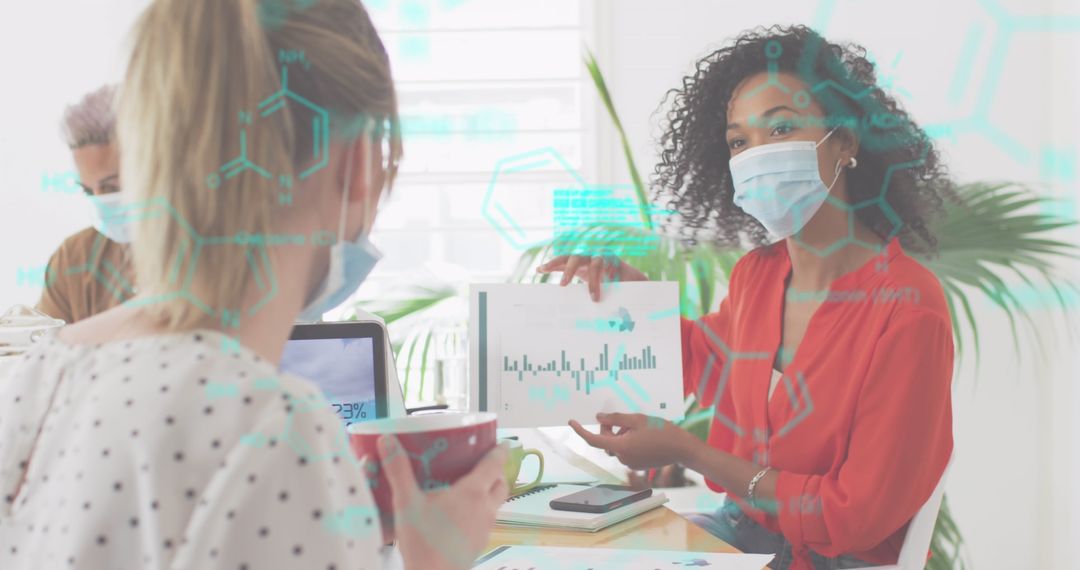 Masked Colleagues Analyzing Digital Data in Modern Office