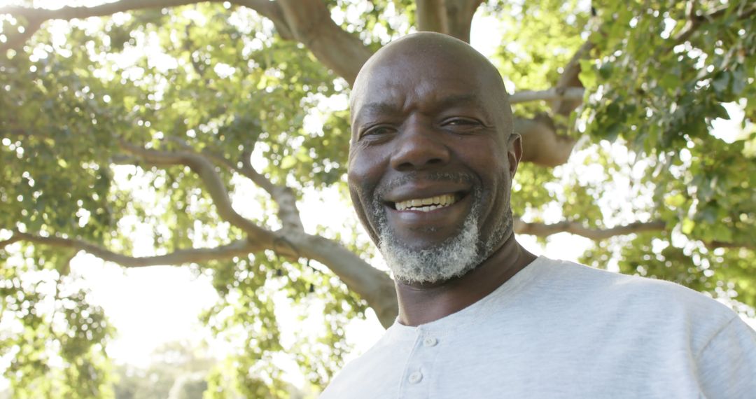 Senior African American Man Smiling Outdoors - Free Images, Stock Photos and Pictures on Pikwizard.com