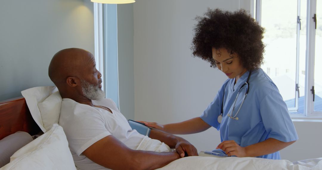 Nurse Checking Blood Pressure of Elderly Male Patient in Hospital Room - Free Images, Stock Photos and Pictures on Pikwizard.com