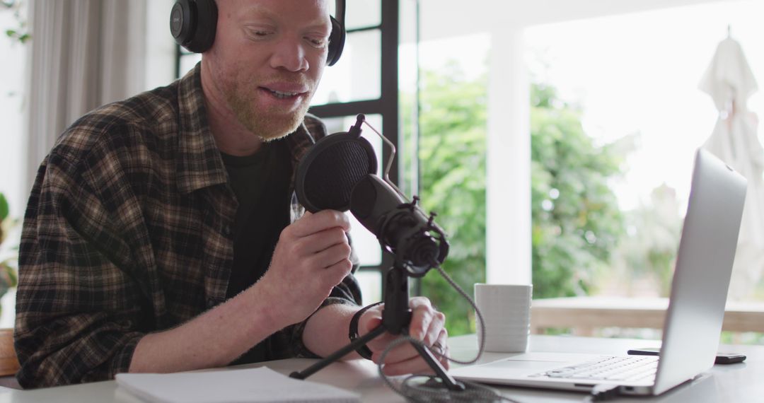 Man Podcasting from Home with Professional Microphone Setup - Free Images, Stock Photos and Pictures on Pikwizard.com