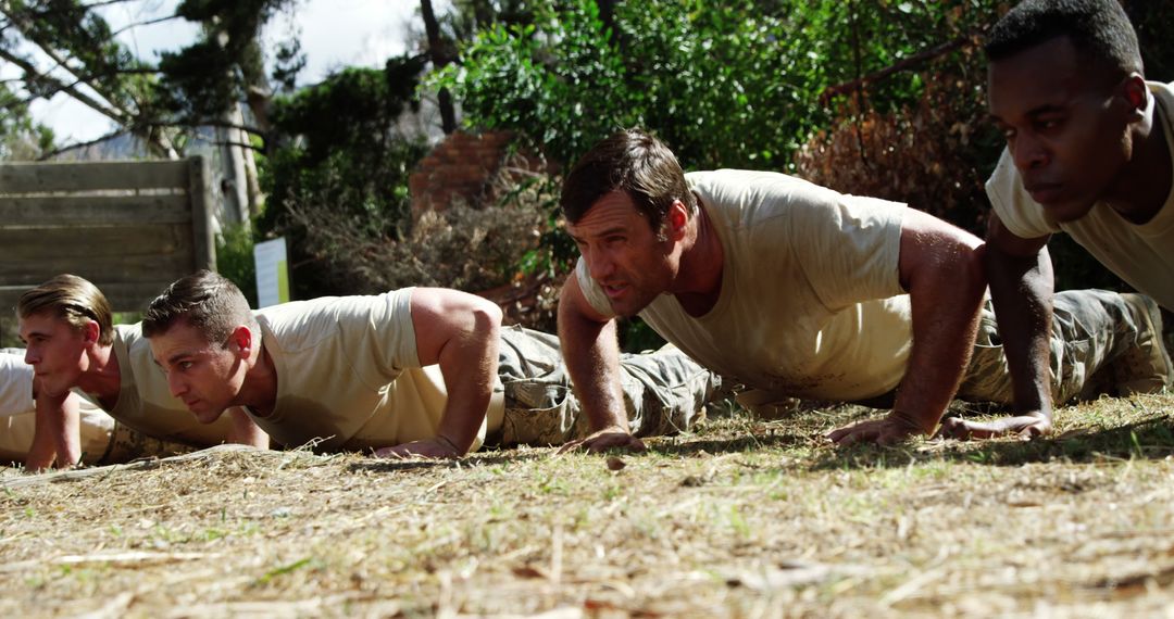 Group of Determined Men Doing Push-Ups During Outdoor Military Training - Free Images, Stock Photos and Pictures on Pikwizard.com