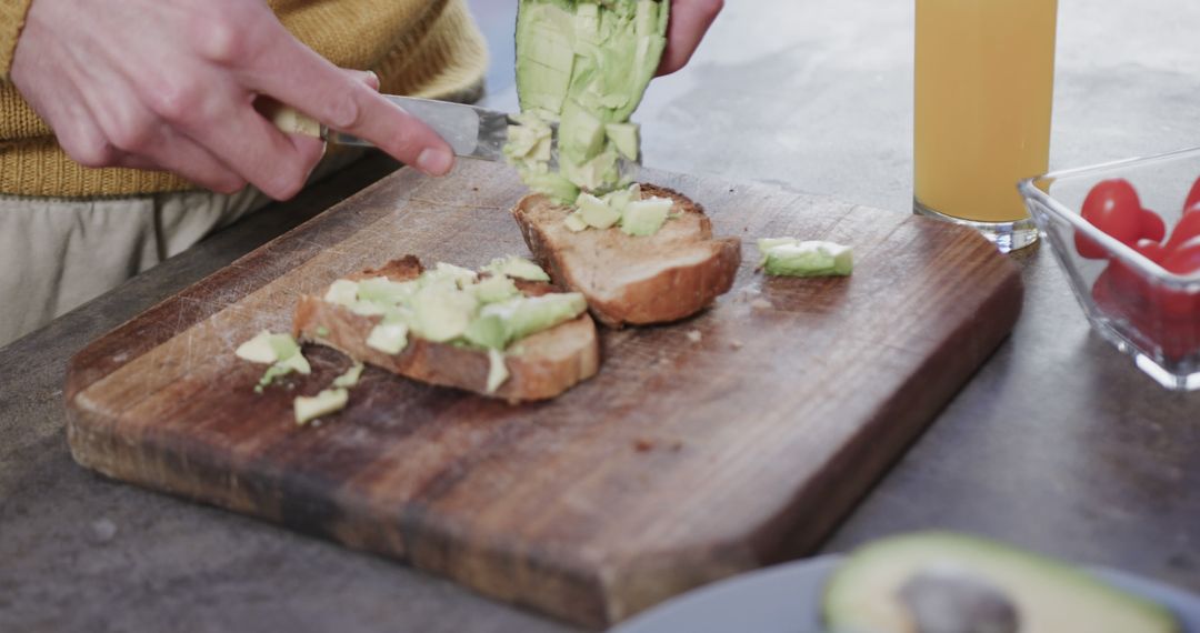 Preparing Avocado Toast on Wooden Cutting Board - Free Images, Stock Photos and Pictures on Pikwizard.com