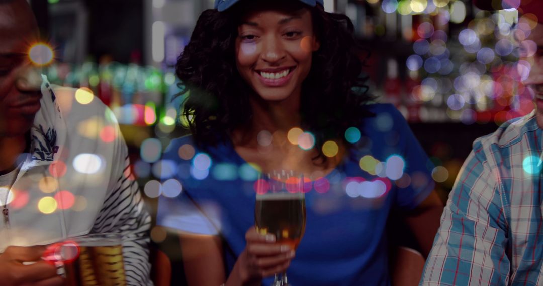 Friends Celebrating at Bar with Beer and Bokeh Lights