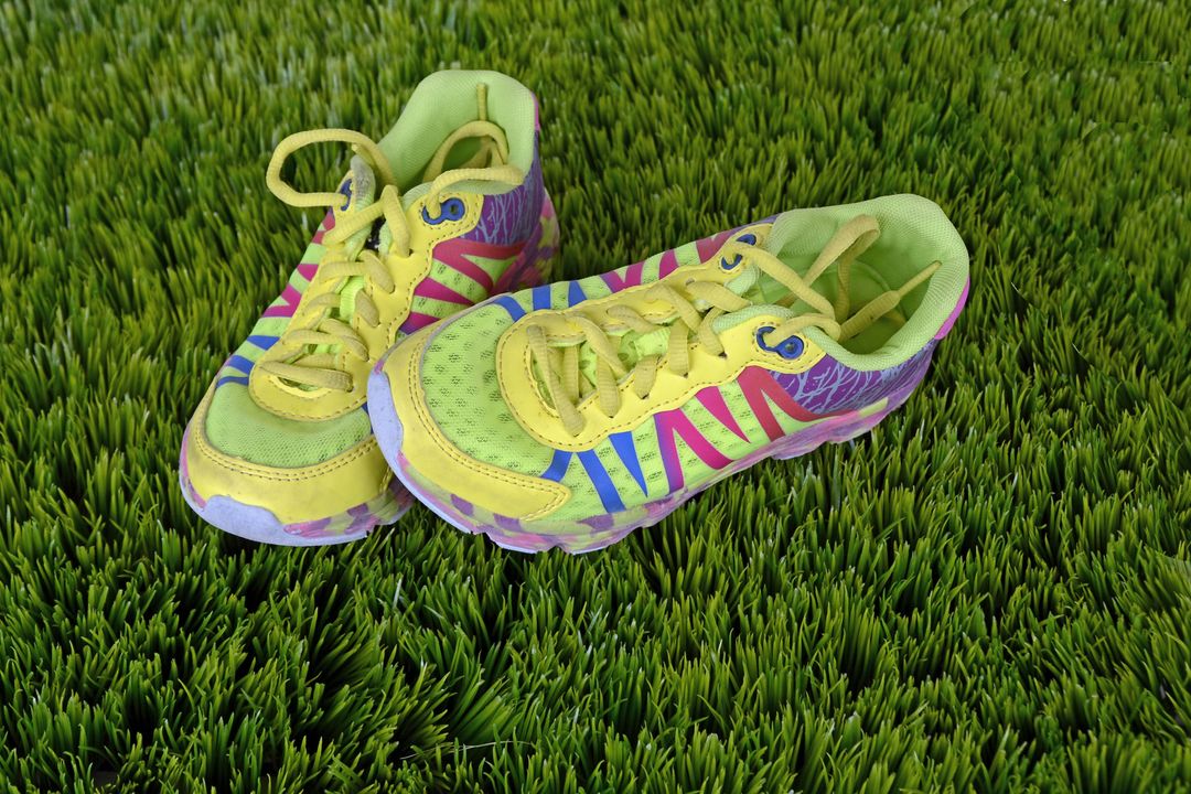 Bright Multicolored Athletic Shoes on Green Grass - Free Images, Stock Photos and Pictures on Pikwizard.com