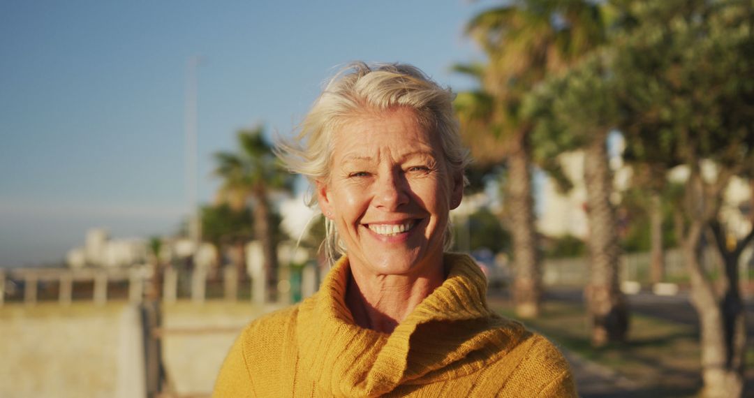 Smiling Senior Woman Enjoying Outdoor Day - Free Images, Stock Photos and Pictures on Pikwizard.com