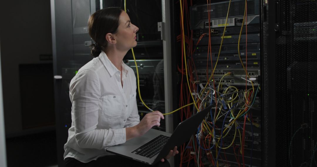 IT Specialist Analyzing Server Room Connections