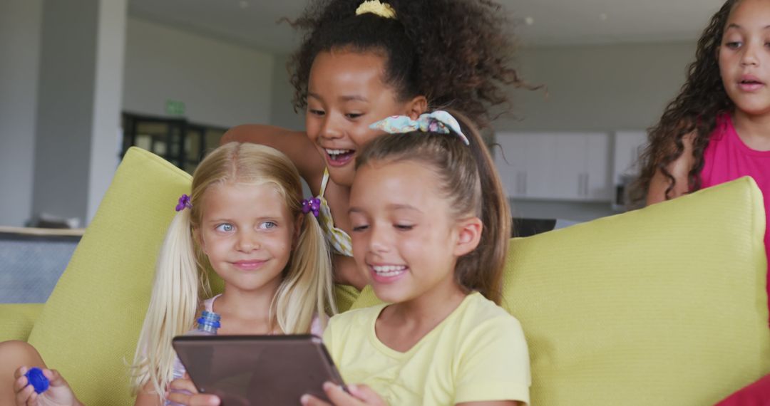 Group of Diverse Girls Using Digital Tablet on Couch - Free Images, Stock Photos and Pictures on Pikwizard.com