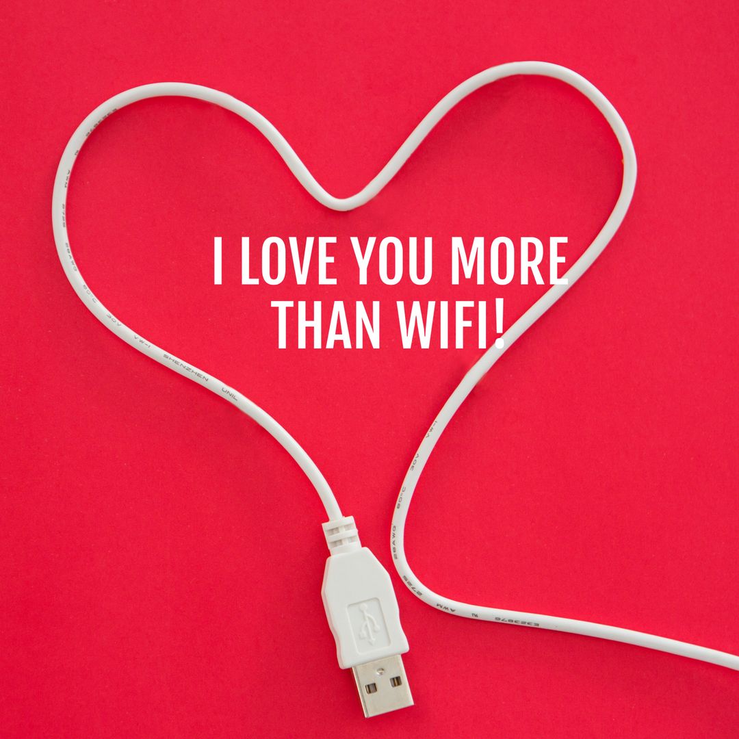 Heart-Shaped USB Cable with Quirky Love Message on Red Background