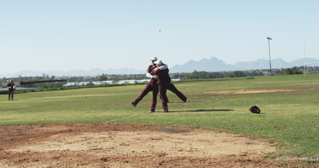 Baseball players celebrating victory on pitcher's mound