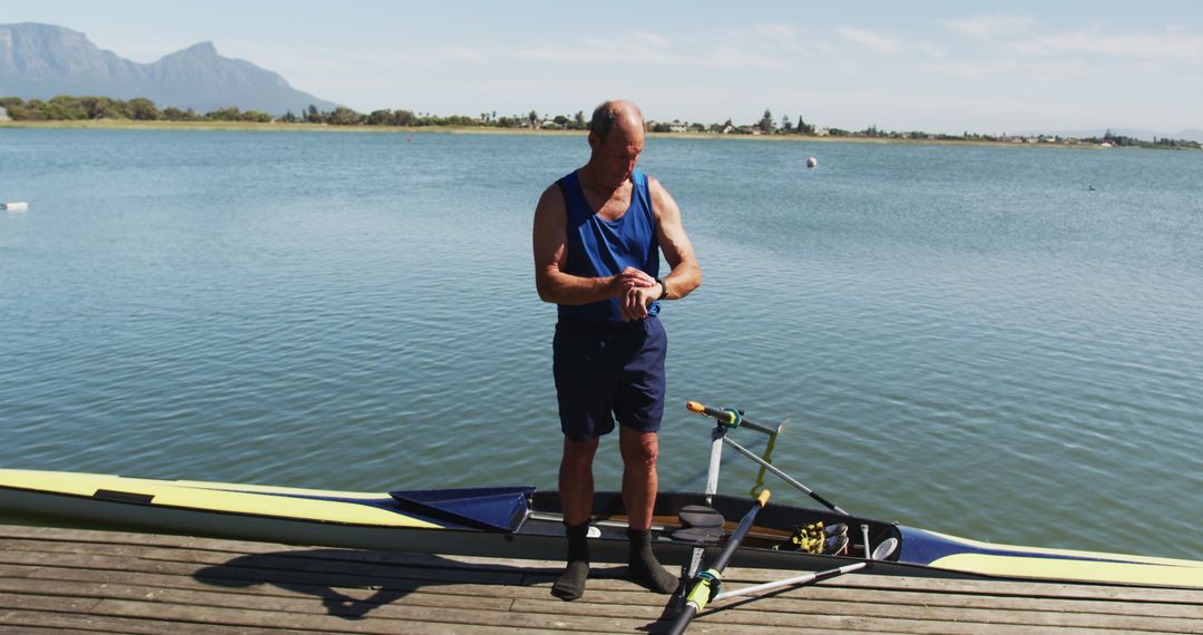 Senior Man Preparing for Kayaking on Sunny Day - Free Images, Stock Photos and Pictures on Pikwizard.com