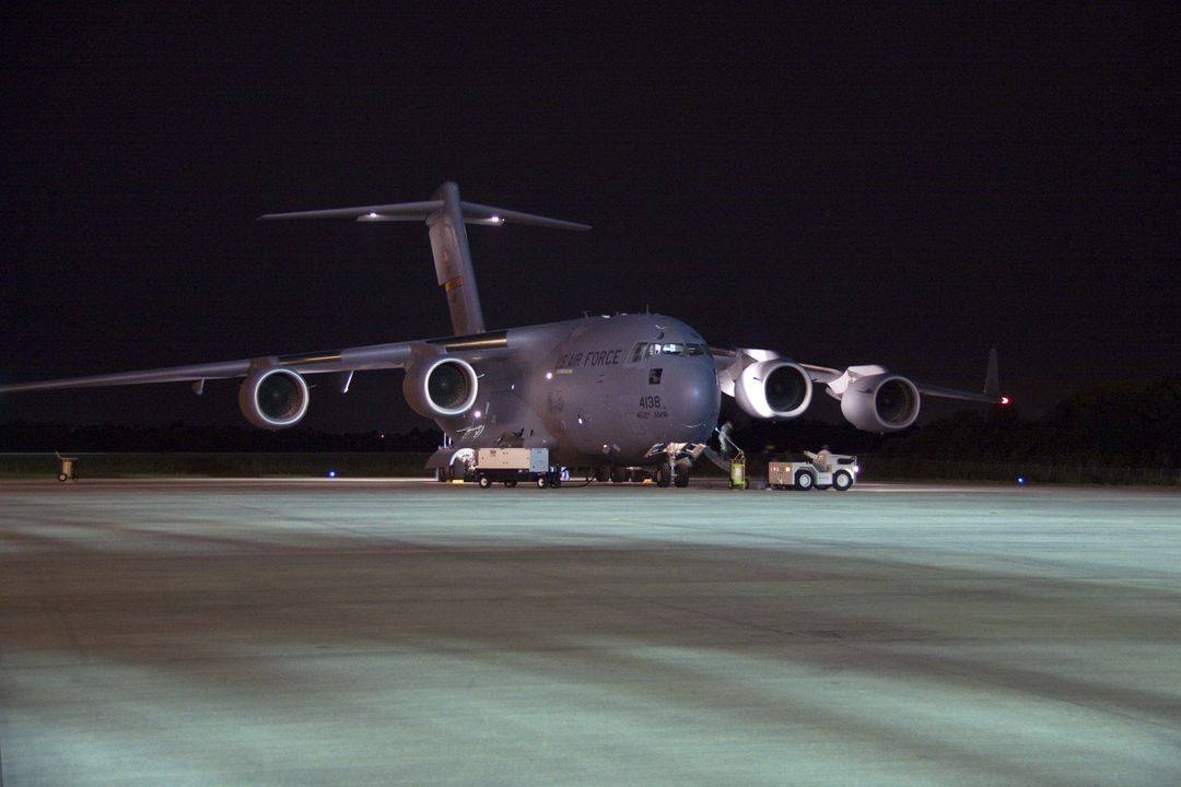 US Air Force C-17 Cargo Plane at Night Unloading NASA Mars Science Laboratory Payload - Free Images, Stock Photos and Pictures on Pikwizard.com