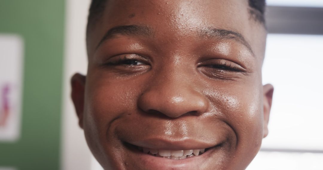 Joyful African American Boy Smiling Close-Up in Bright Room