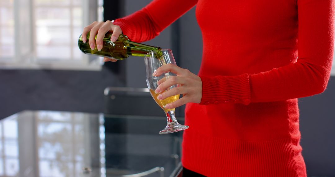 Casual Office Refreshment: Pouring Beer in Modern Workspace