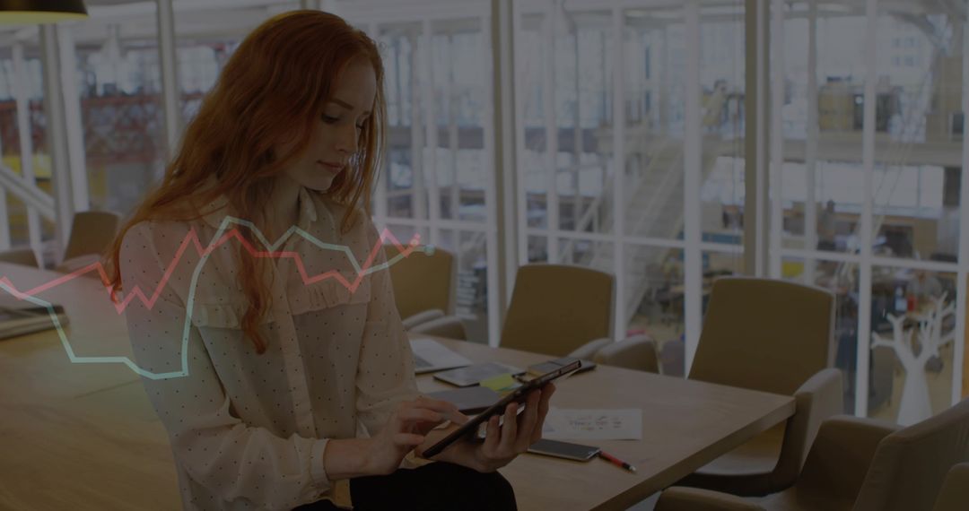 Businesswoman Using Tablet in Modern Office Space with Graph Overlay