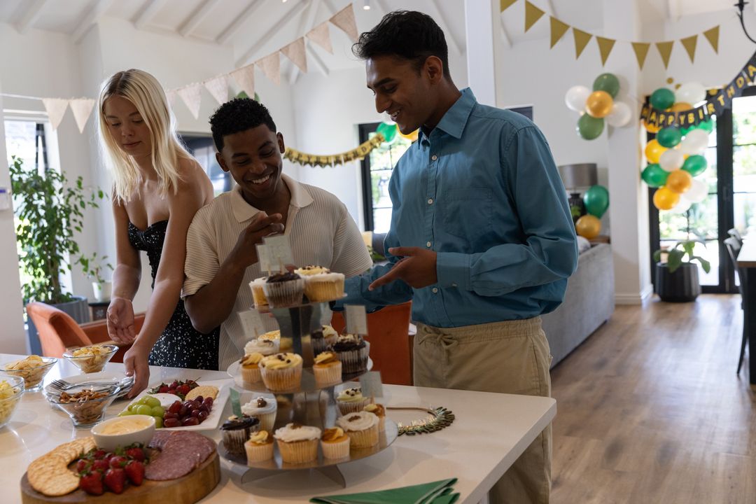 Multiracial Friends Enjoying Vibrant Party with Cupcakes