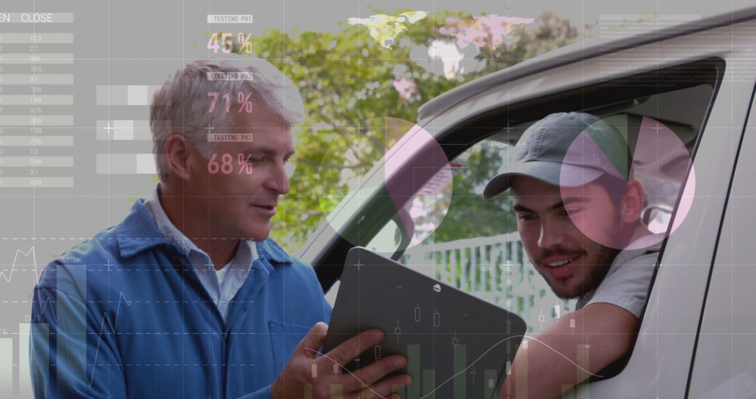 Technician Discussing Data on Digital Tablet with Delivery Driver - Free Images, Stock Photos and Pictures on Pikwizard.com