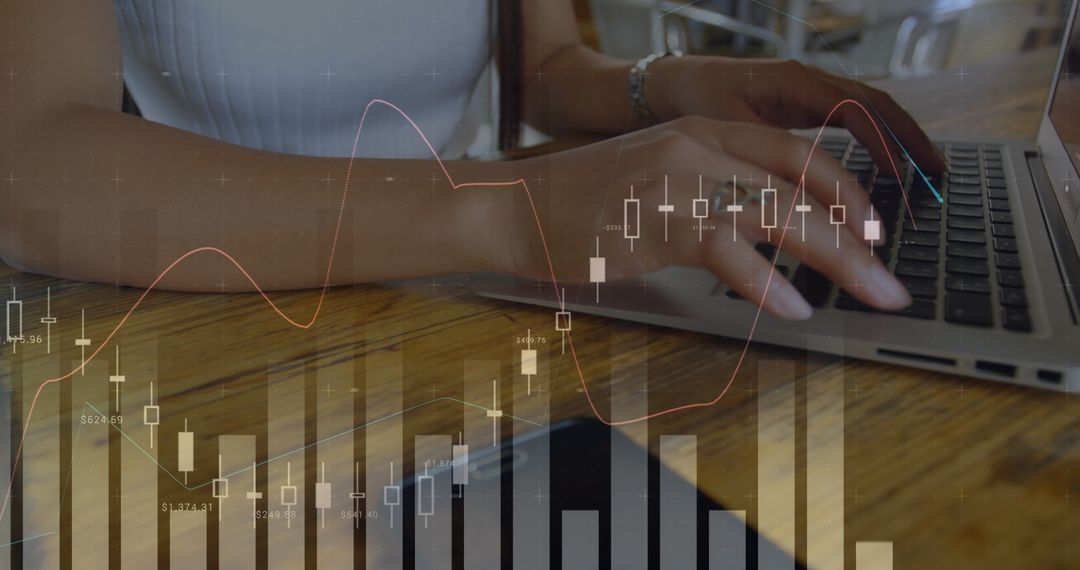 Hands Typing on Laptop with Financial Stock Analysis Overlay