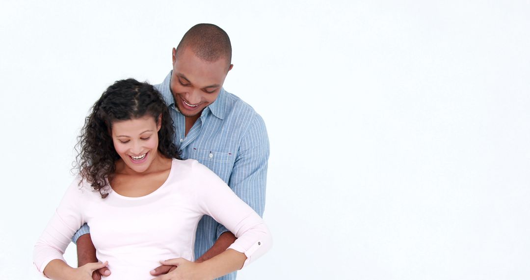 Happy African American Couple Embracing Expecting Baby - Free Images, Stock Photos and Pictures on Pikwizard.com