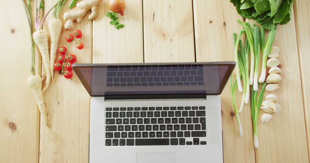 Image of fresh vegetables around laptop on wooden background - Free Images, Stock Photos and Pictures on Pikwizard.com