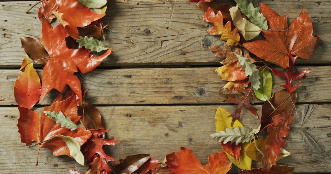 Autumn Leaves Wreath on Rustic Wooden Background - Free Images, Stock Photos and Pictures on Pikwizard.com