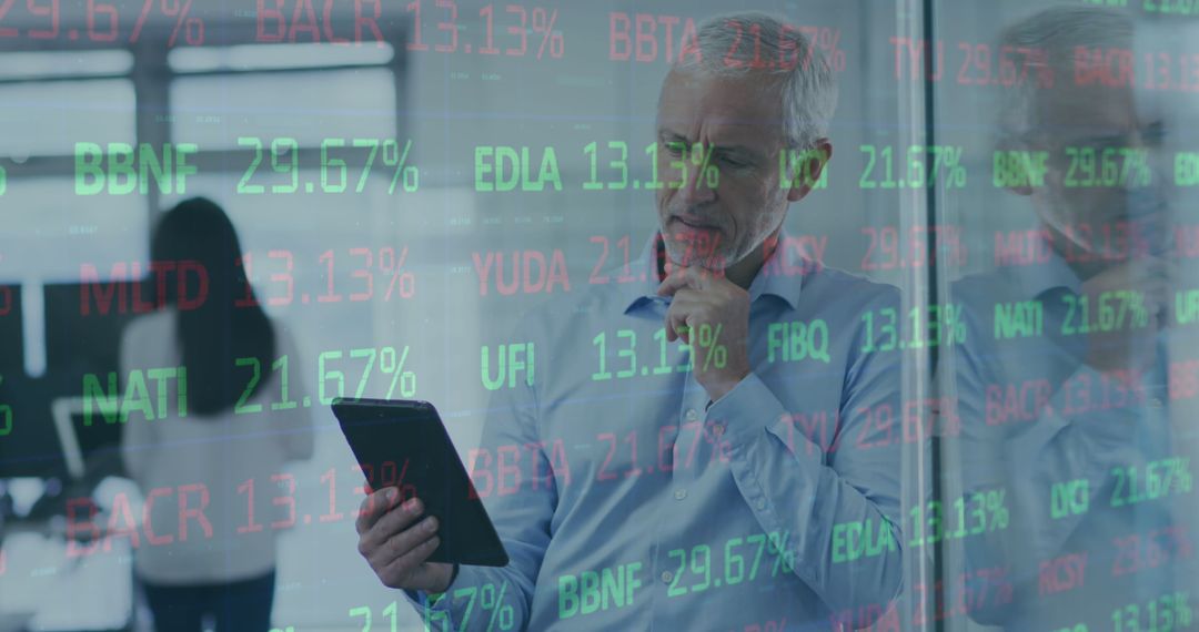 Businessman Analyzing Stock Market Data on Tablet Screen
