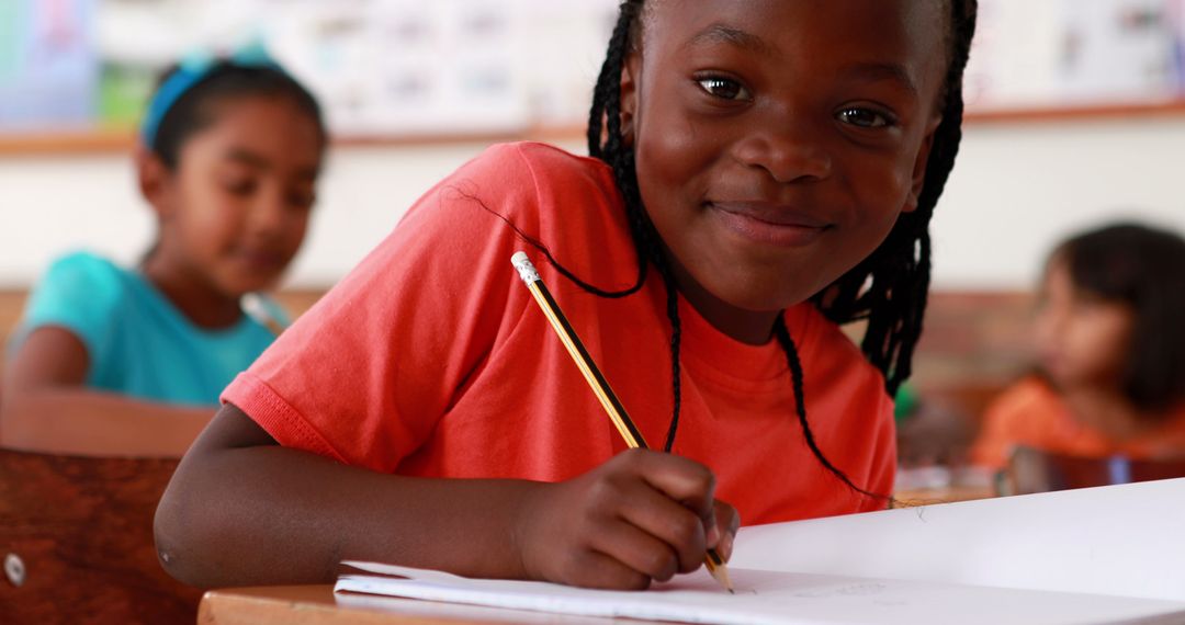 Smiling African American Girl Learning in Class - Free Images, Stock Photos and Pictures on Pikwizard.com