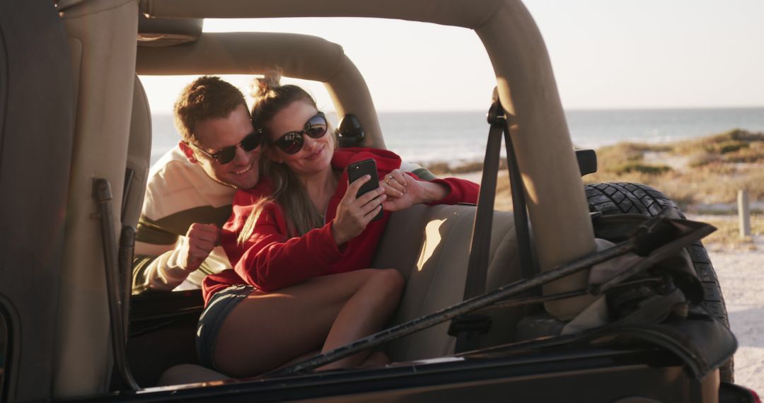 Couple Riding in Convertible Taking Selfie on Beach Vacation - Free Images, Stock Photos and Pictures on Pikwizard.com