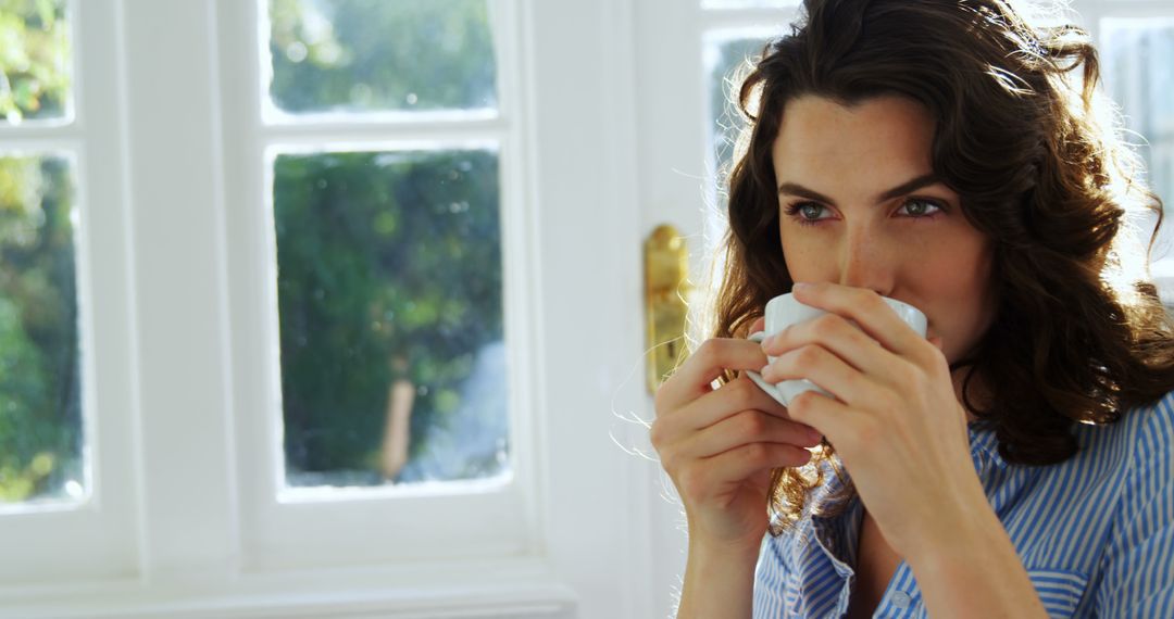 Woman Drinking Morning Coffee by Window - Free Images, Stock Photos and Pictures on Pikwizard.com