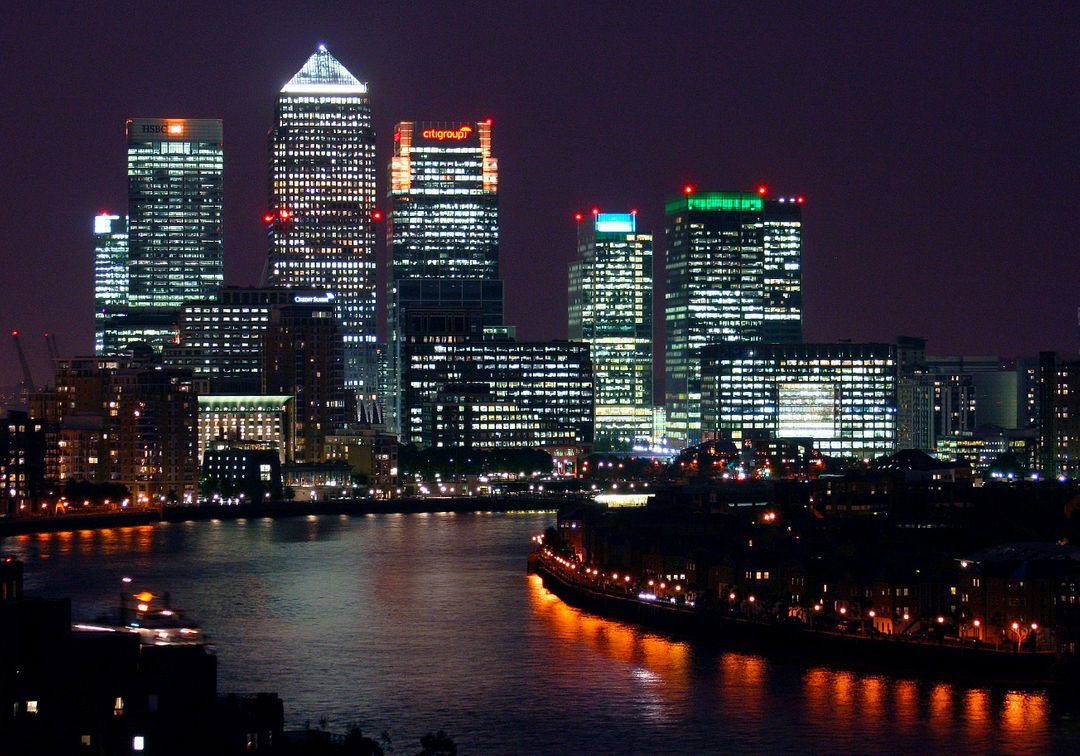 Illuminated London Skyline at Night with Reflections in River Thames - Free Images, Stock Photos and Pictures on Pikwizard.com