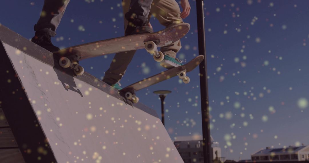 Skateboarders Launching Off Ramp with Sparkling Bokeh Lights Urban Action Duo Midair Tricks Skatepar