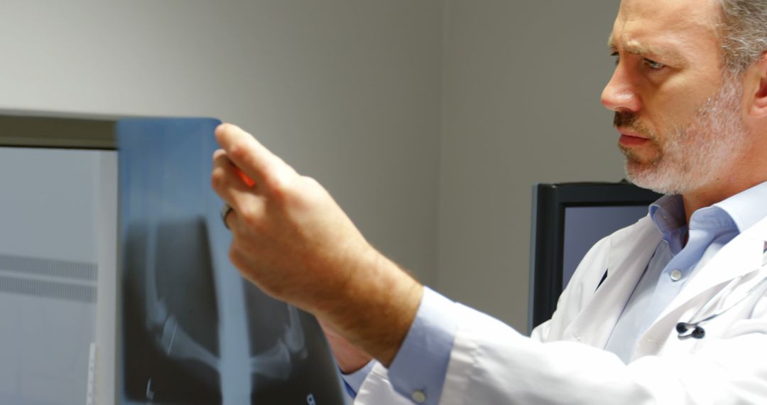 Doctor Analyzing Patient X-ray in Diagnostic Clinic - Free Images, Stock Photos and Pictures on Pikwizard.com