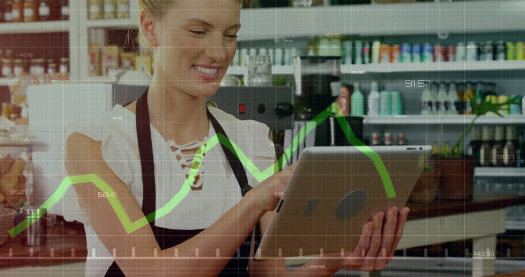 Smiling Entrepreneur Analyzing Growth Trends in Kitchen