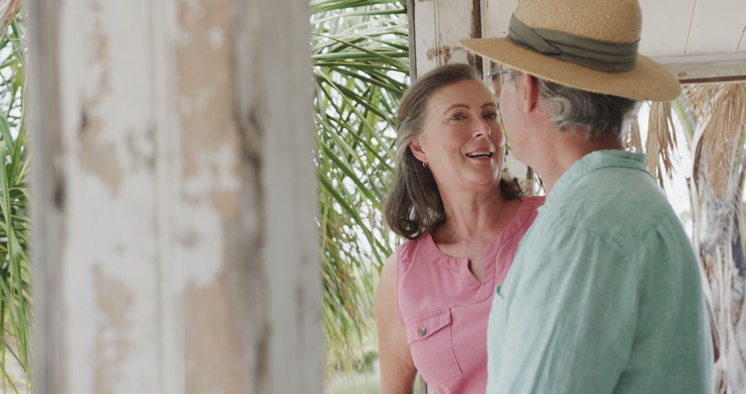 Happy Senior Couple Embracing By Beachside Home - Free Images, Stock Photos and Pictures on Pikwizard.com