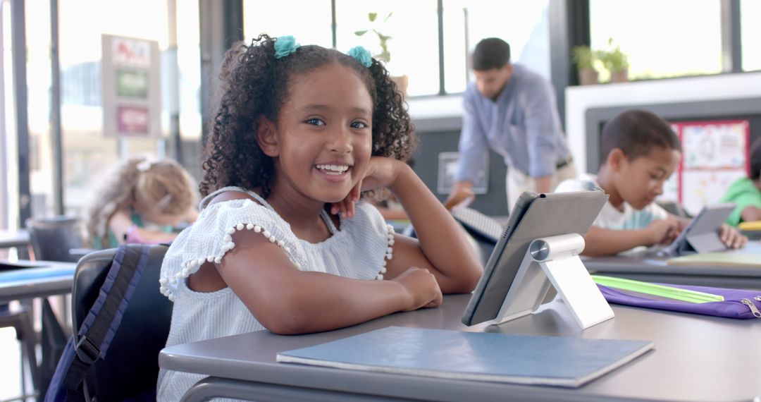 Smiling Girl in Classroom Using Tablet for Learning Activities