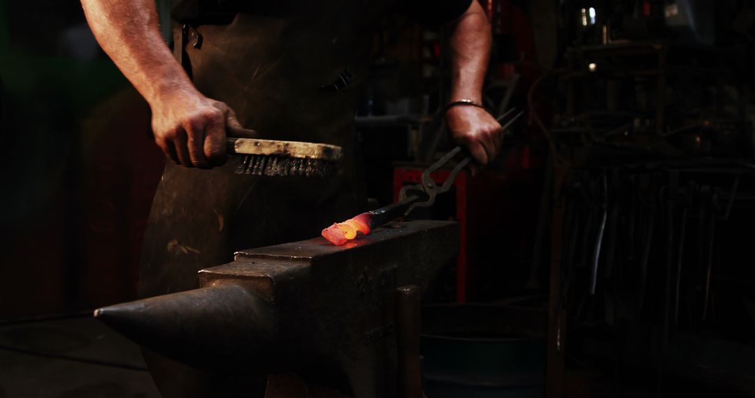 Blacksmith Crafting Metal on Anvil in Workshop - Free Images, Stock Photos and Pictures on Pikwizard.com