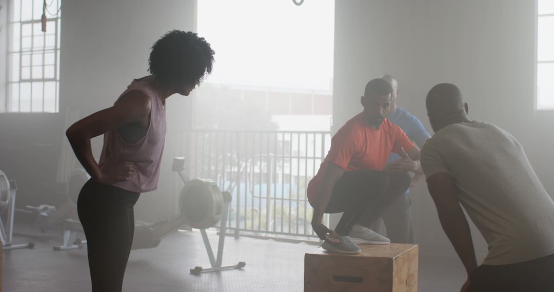 Diverse Athletes Engaging in Group Tyr Workout Session