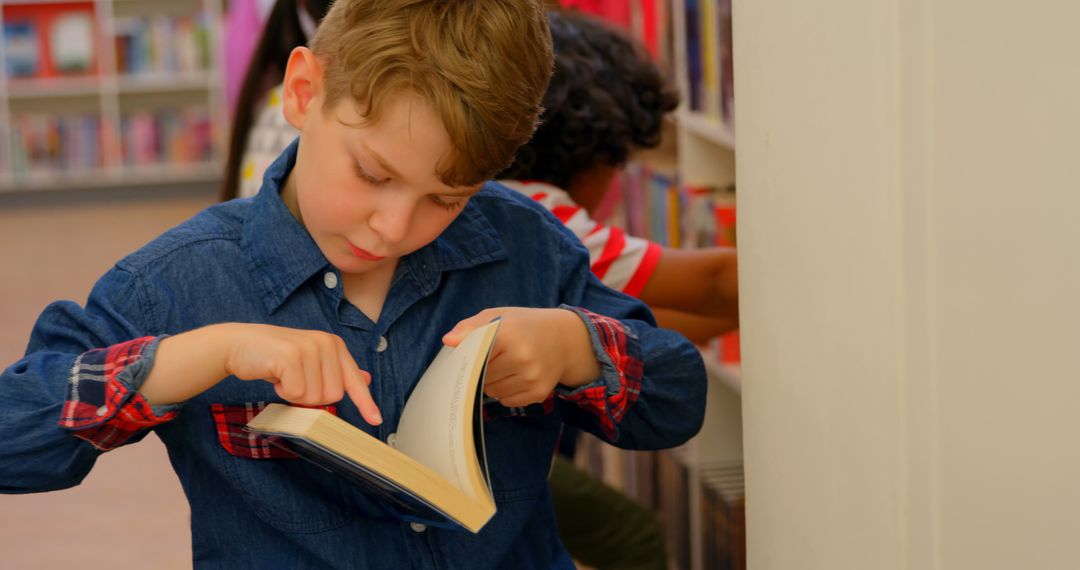 Curious Boy Reading and Exploring Books in Library
