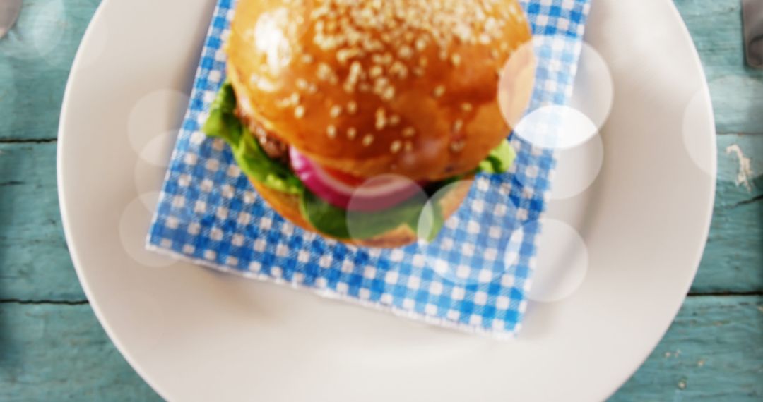 Tasty Burger with Bokeh Effect on Wooden Table