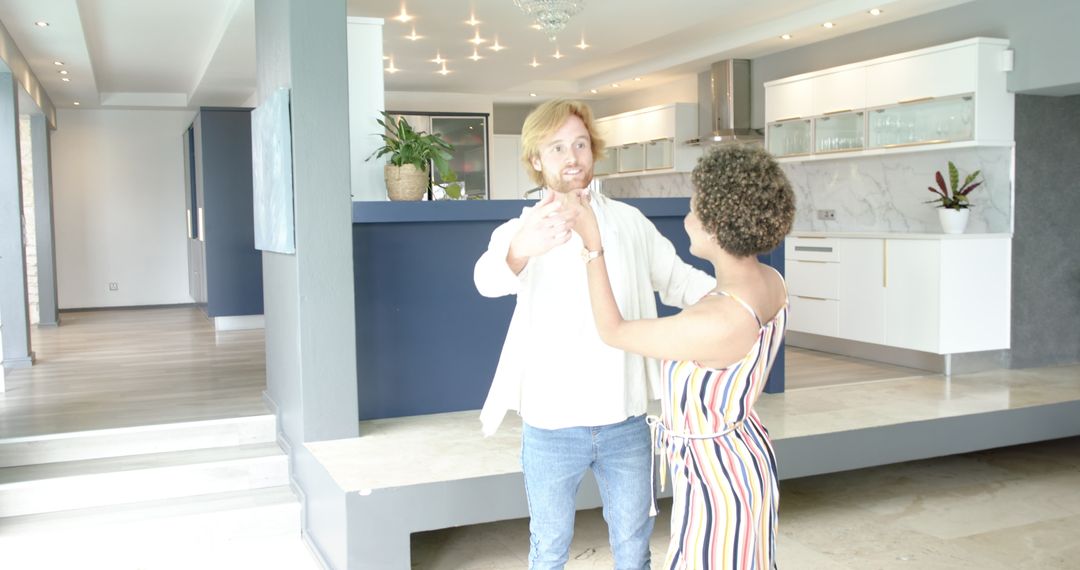 Happy Couple and Realtor Exploring Modern Luxurious Home Interior
